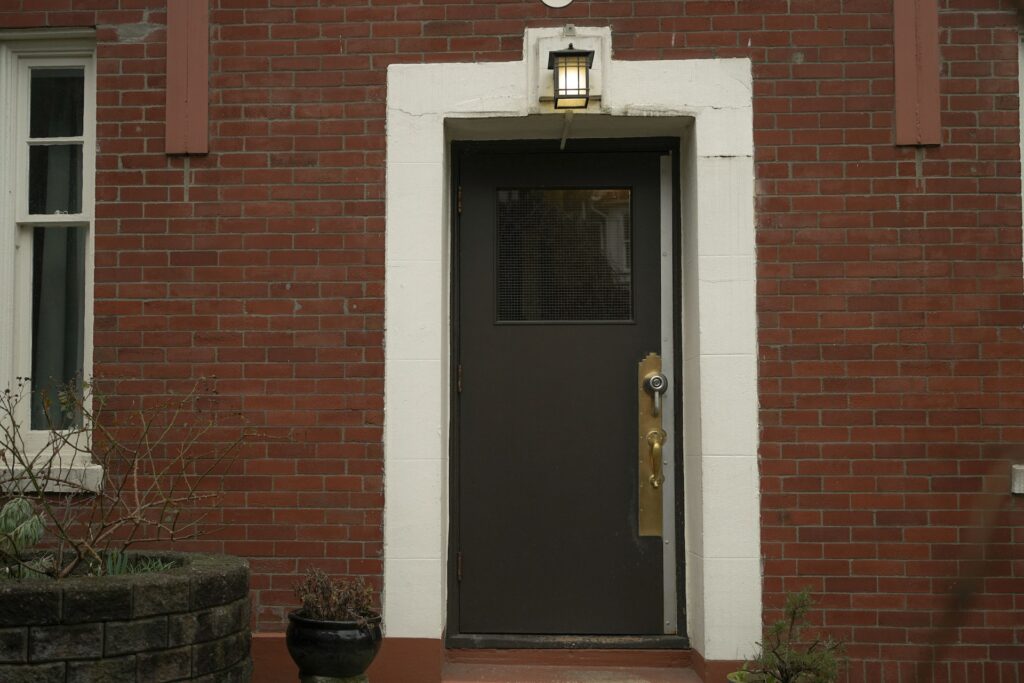 A green steel entry door